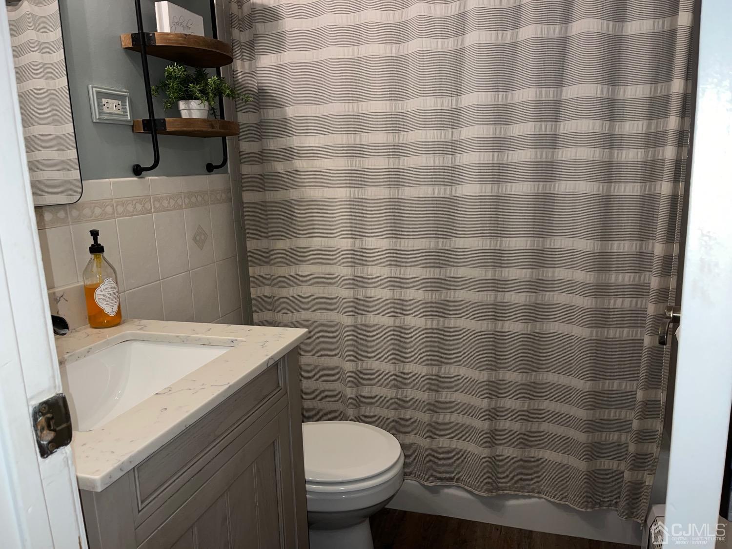34 Dalton Place Edison, NJ 08817 - Photo 16 of 20 a bathroom with a sink toilet and shower