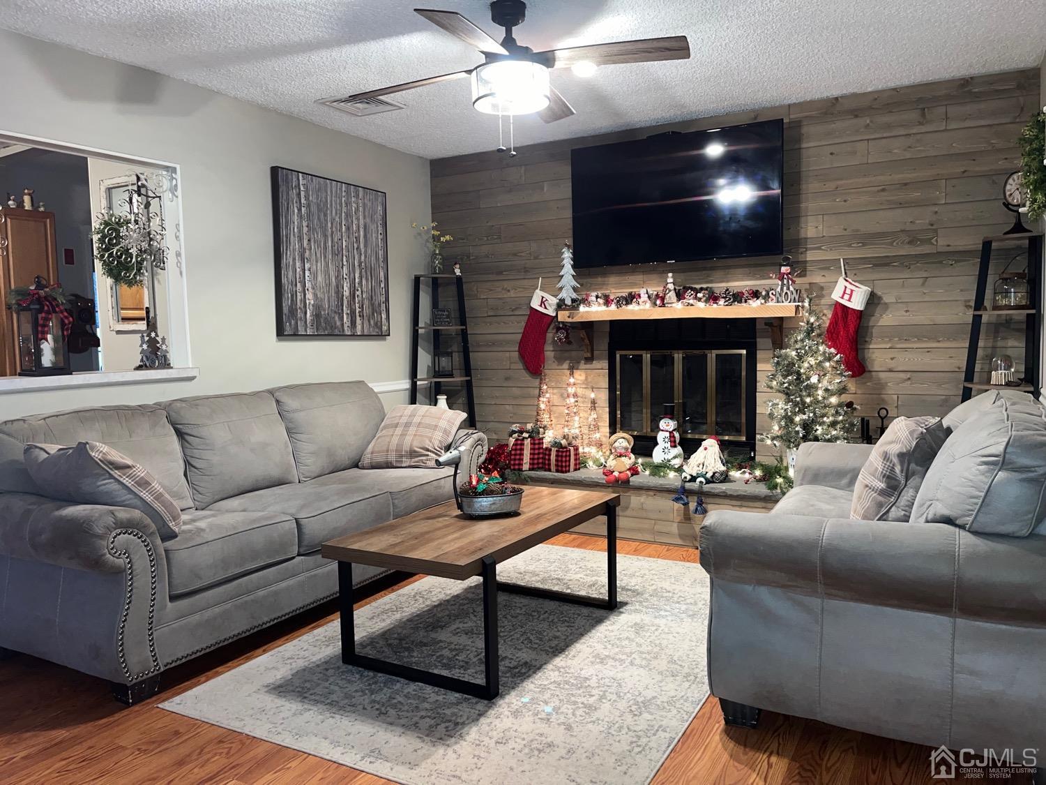34 Dalton Place Edison, NJ 08817 - Photo 3 of 20 a living room with furniture a fireplace and a flat screen tv
