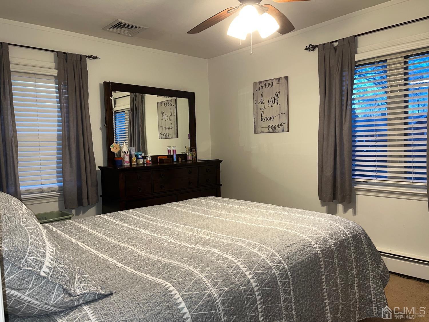 34 Dalton Place Edison, NJ 08817 - Photo 4 of 20 a bedroom with a large bed and a window