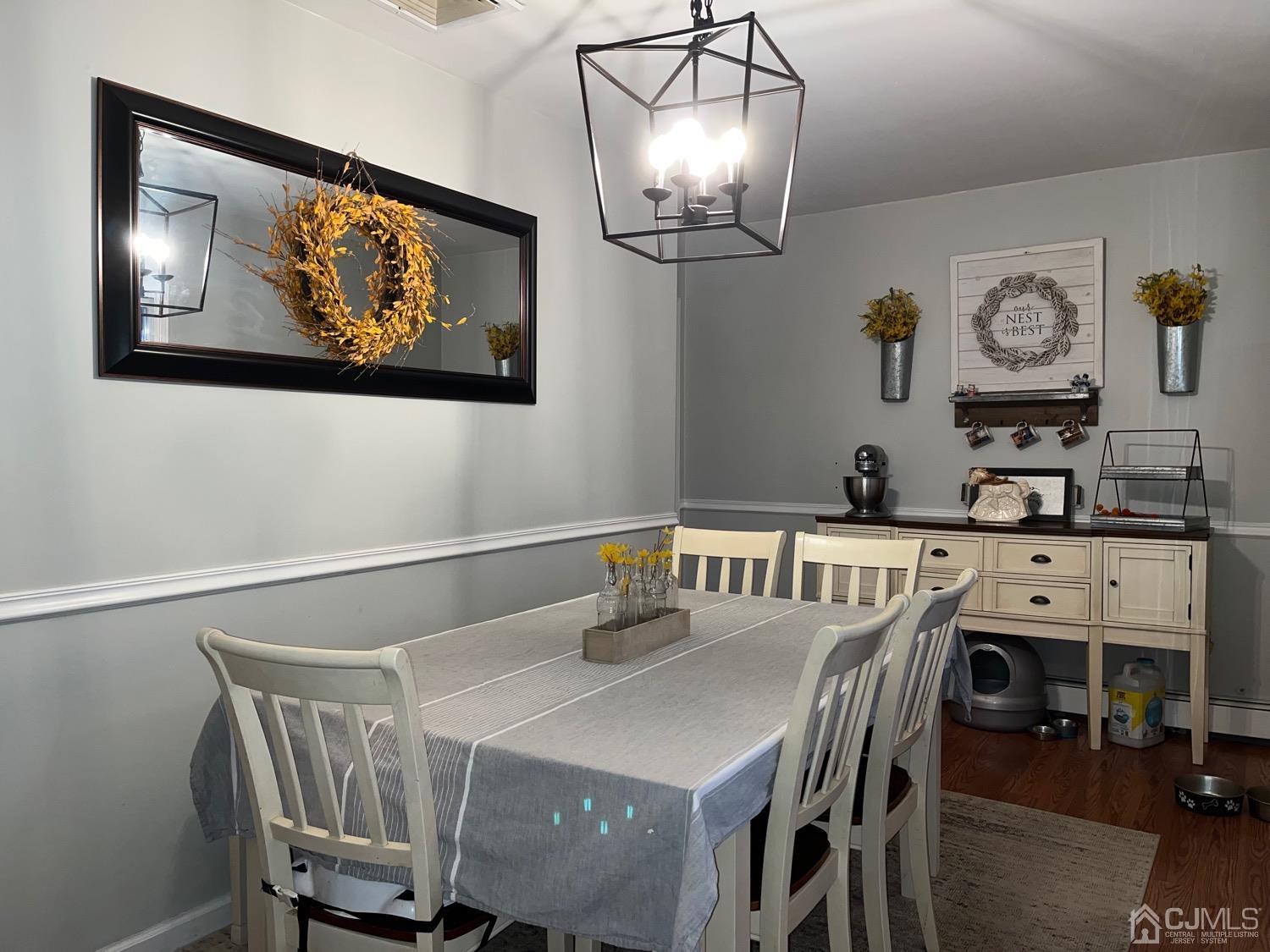 34 Dalton Place Edison, NJ 08817 - Photo 6 of 20 a view of a dining room with furniture a chandelier and wooden floor