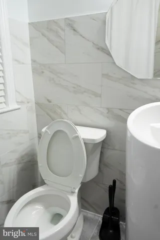 a white bath tub sitting in a bathroom