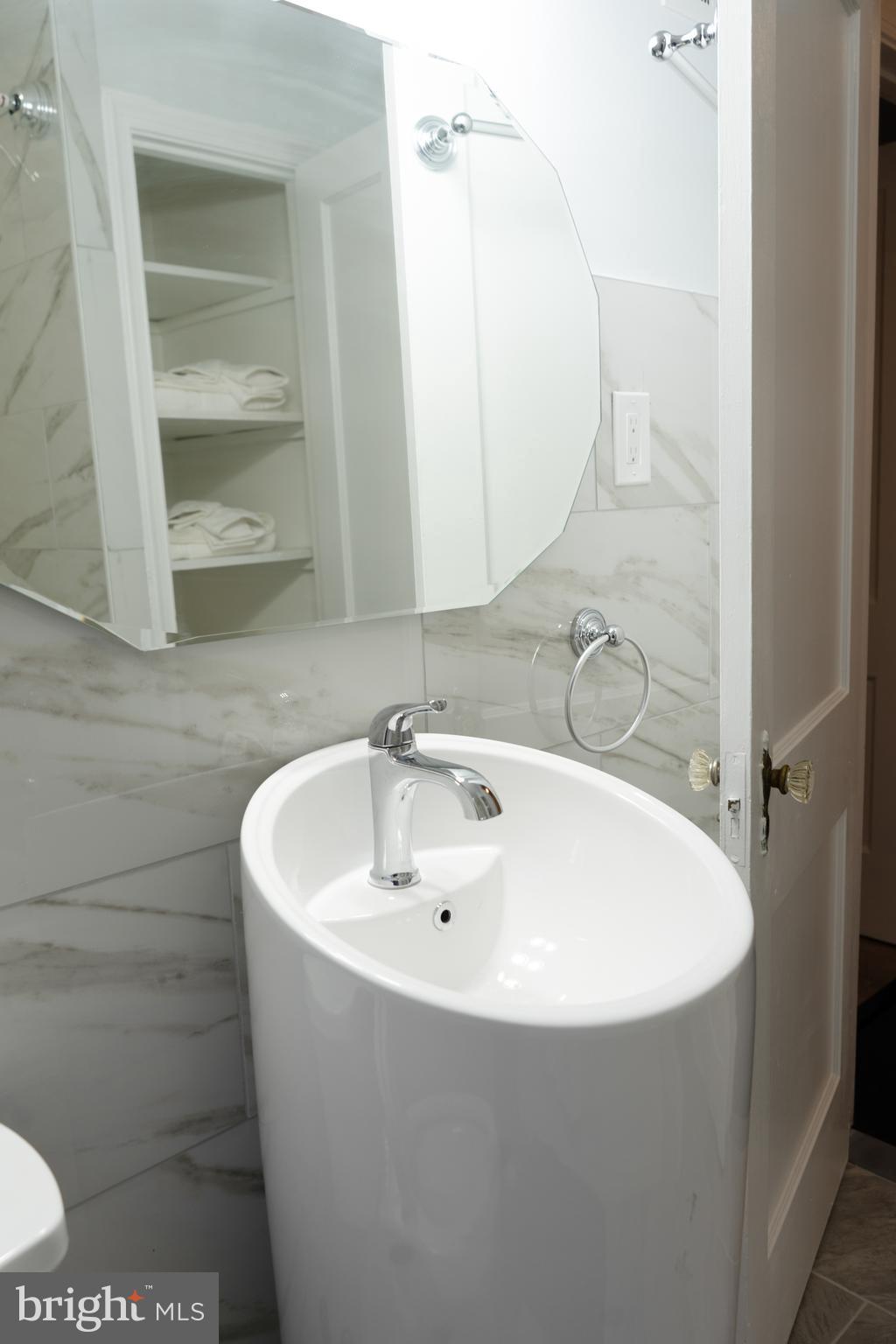 7329 12th Street Northwest Washington, DC 20012 - Photo 12 of 20 a white bath tub sitting in a bathroom