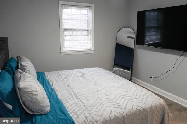 a large white bed in a small room