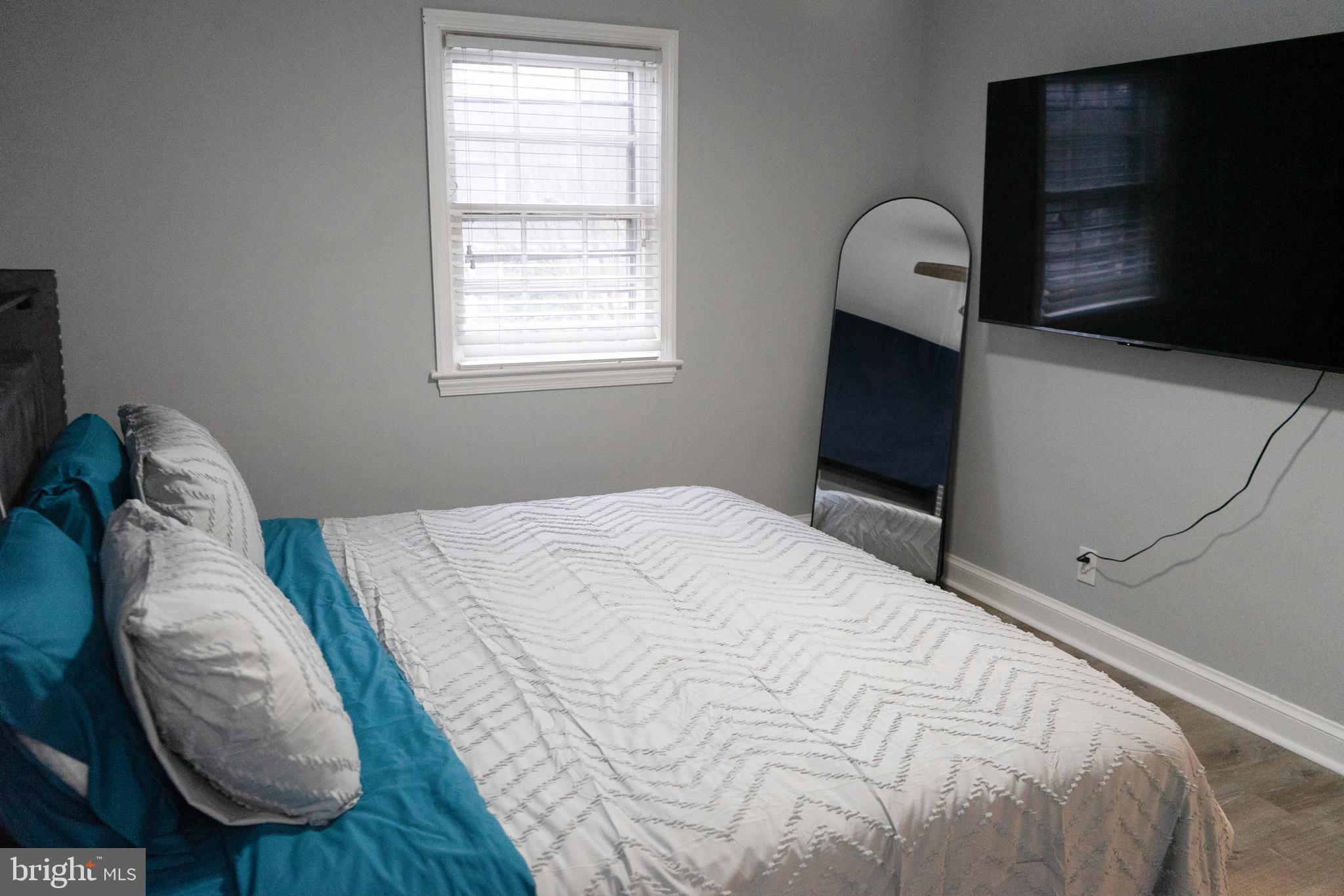 7329 12th Street Northwest Washington, DC 20012 - Photo 14 of 20 a bedroom with a bed and a window