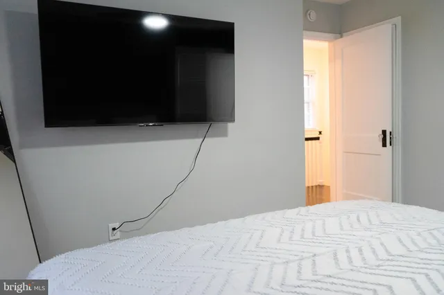 a white toilet sitting next to a white sink