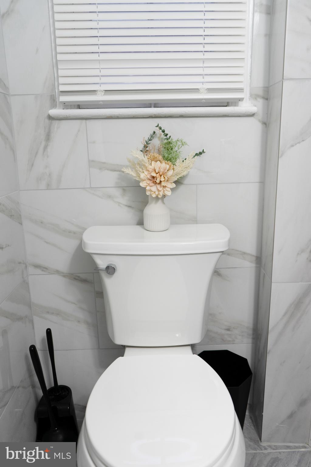 7329 12th Street Northwest Washington, DC 20012 - Photo 17 of 20 a white toilet sitting next to a white sink