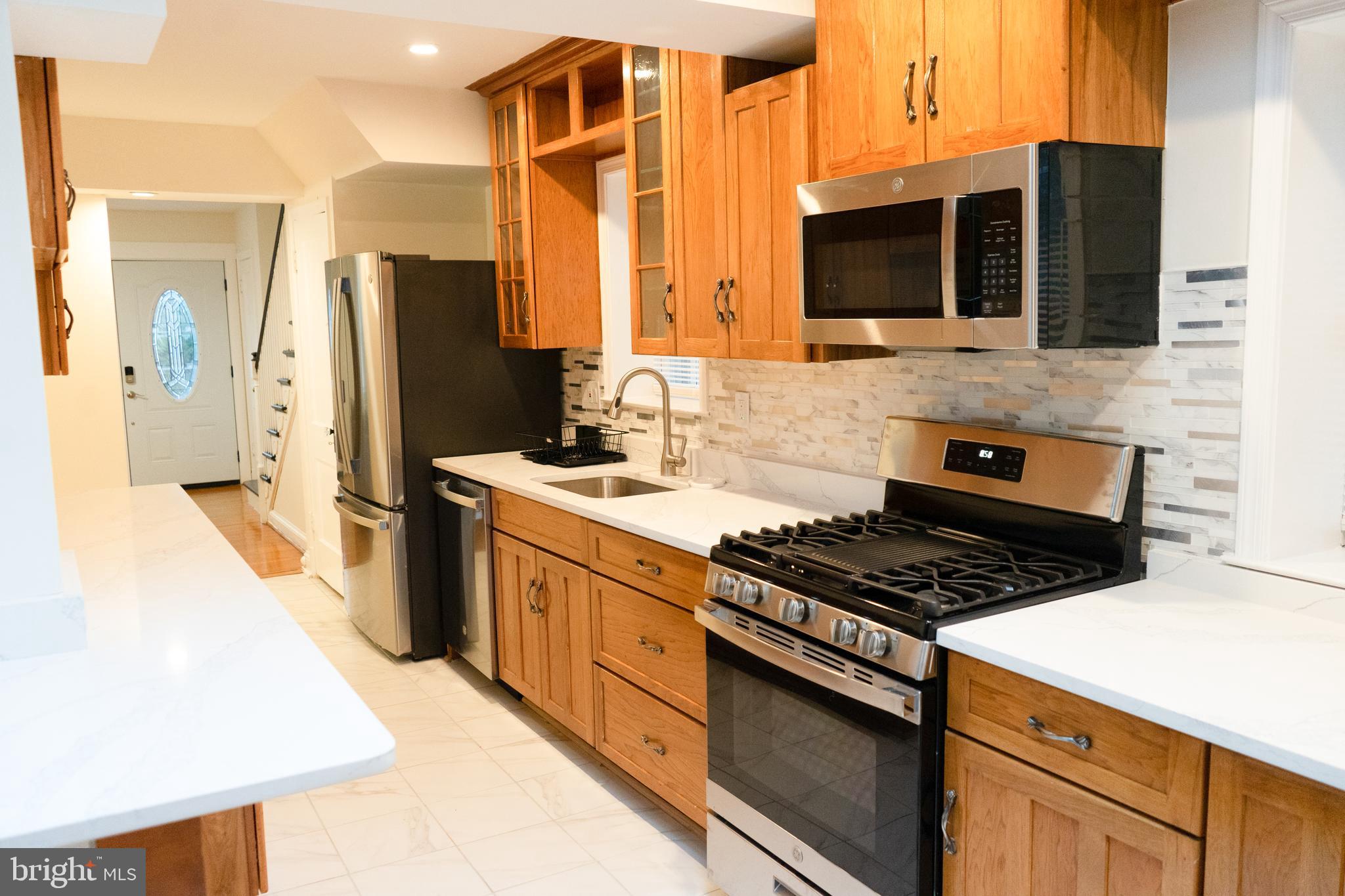 7329 12th Street Northwest Washington, DC 20012 - Photo 4 of 20 a kitchen with stainless steel appliances a stove microwave and refrigerator