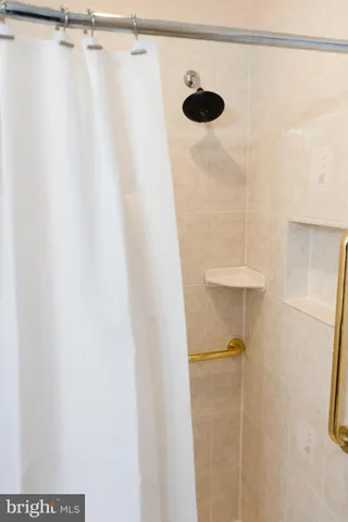 a view of entryway and gallery with wooden floor