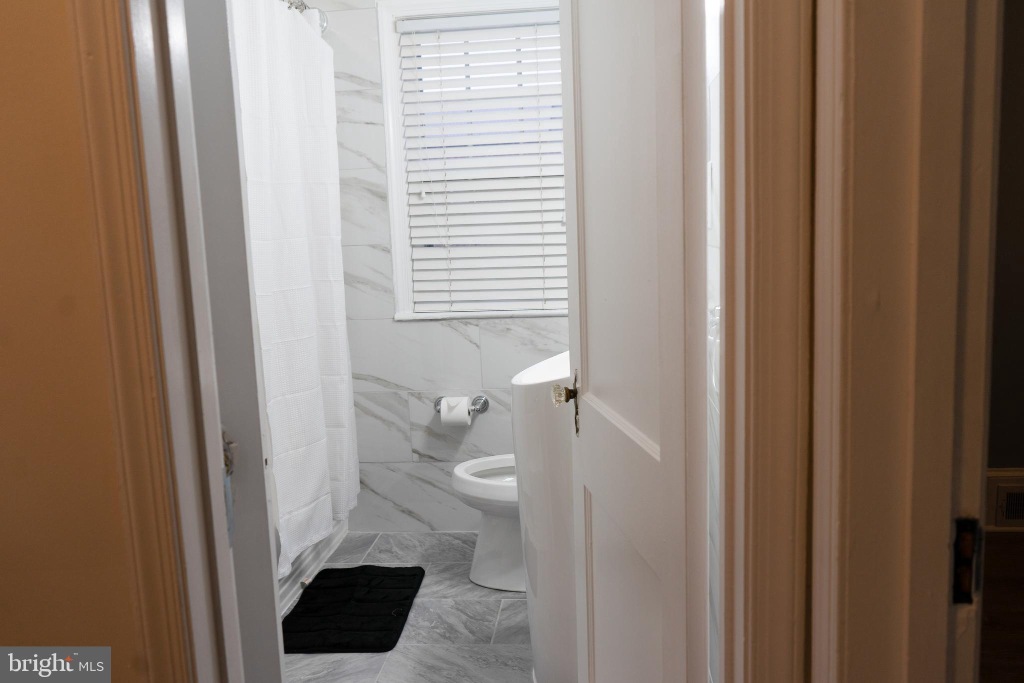 7329 12th Street Northwest Washington, DC 20012 - Photo 8 of 20 a bathroom with a sink and a toilet