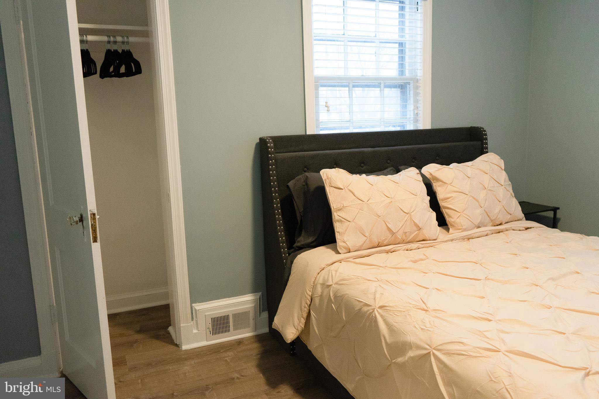 7329 12th Street Northwest Washington, DC 20012 - Photo 10 of 20 a bed sitting in a bedroom next to a window