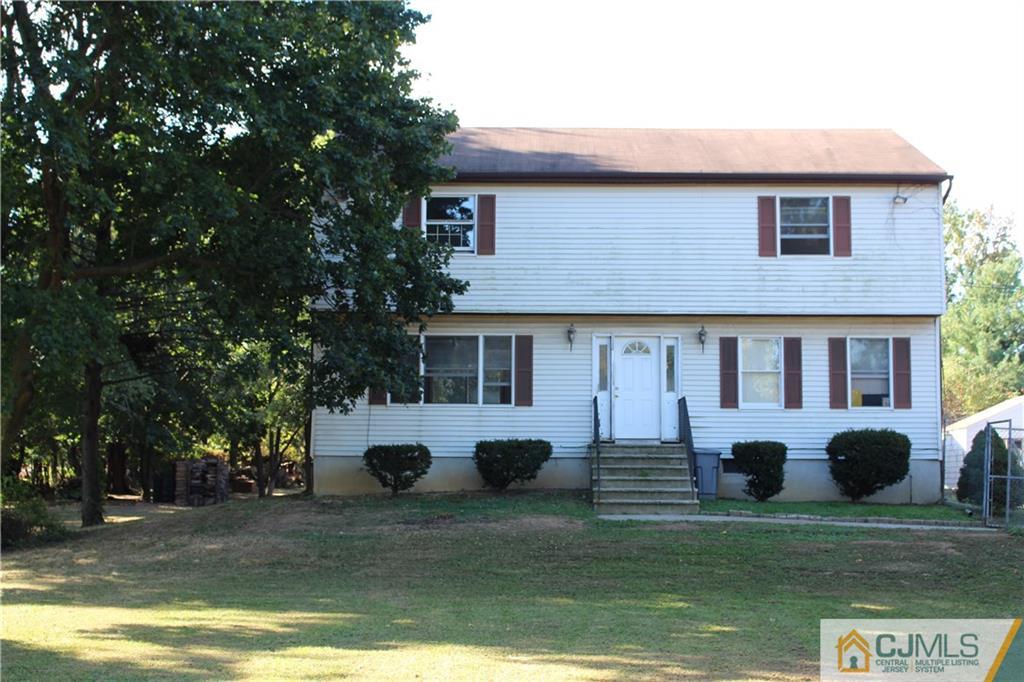 317 Ridge Road Dayton, NJ 08810 - Photo 1 of 16 a view of a house with a yard