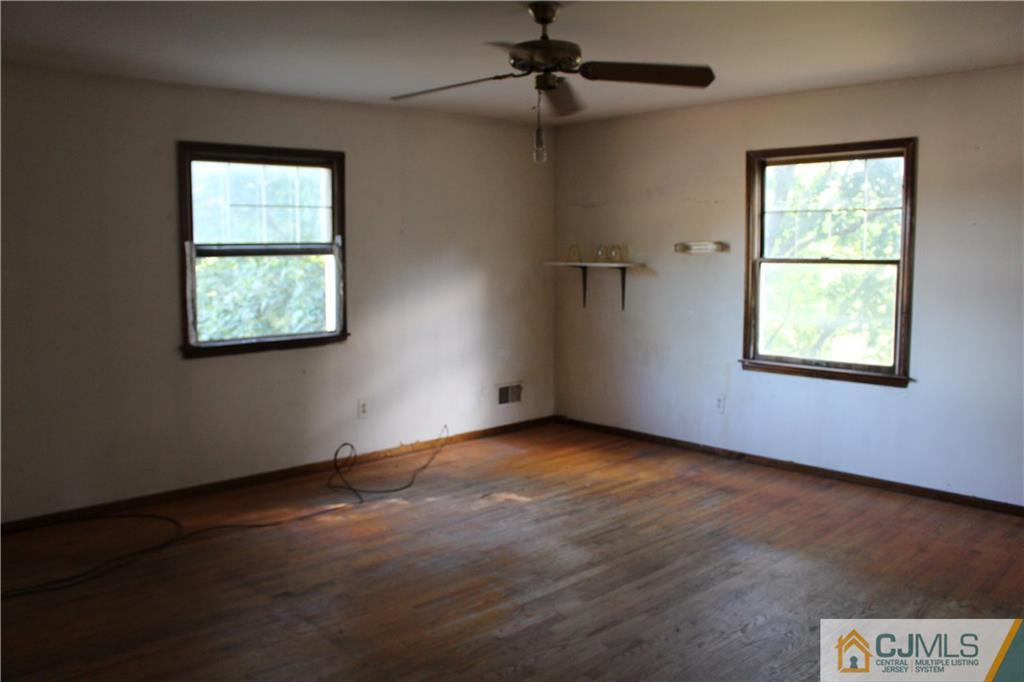 317 Ridge Road Dayton, NJ 08810 - Photo 13 of 16 an empty room with windows and fan