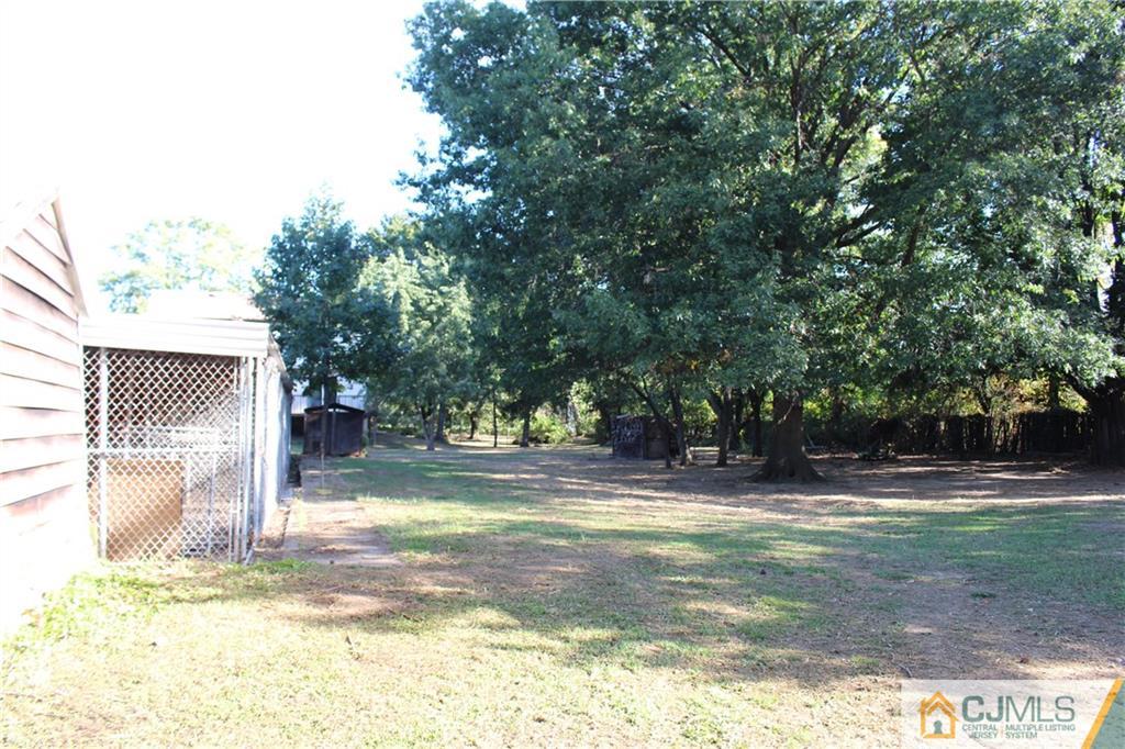 317 Ridge Road Dayton, NJ 08810 - Photo 6 of 16 a view of a house with a yard and tree s