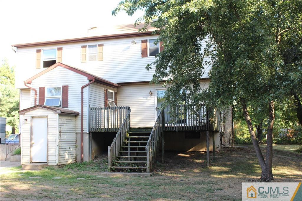 317 Ridge Road Dayton, NJ 08810 - Photo 7 of 16 a front view of a house with a porch