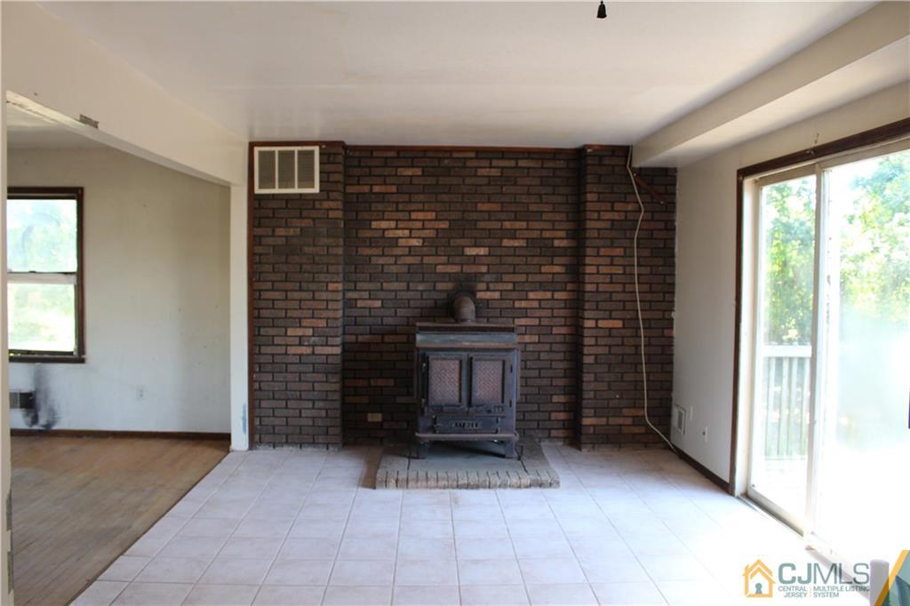 317 Ridge Road Dayton, NJ 08810 - Photo 9 of 16 a view of an empty room and fire place