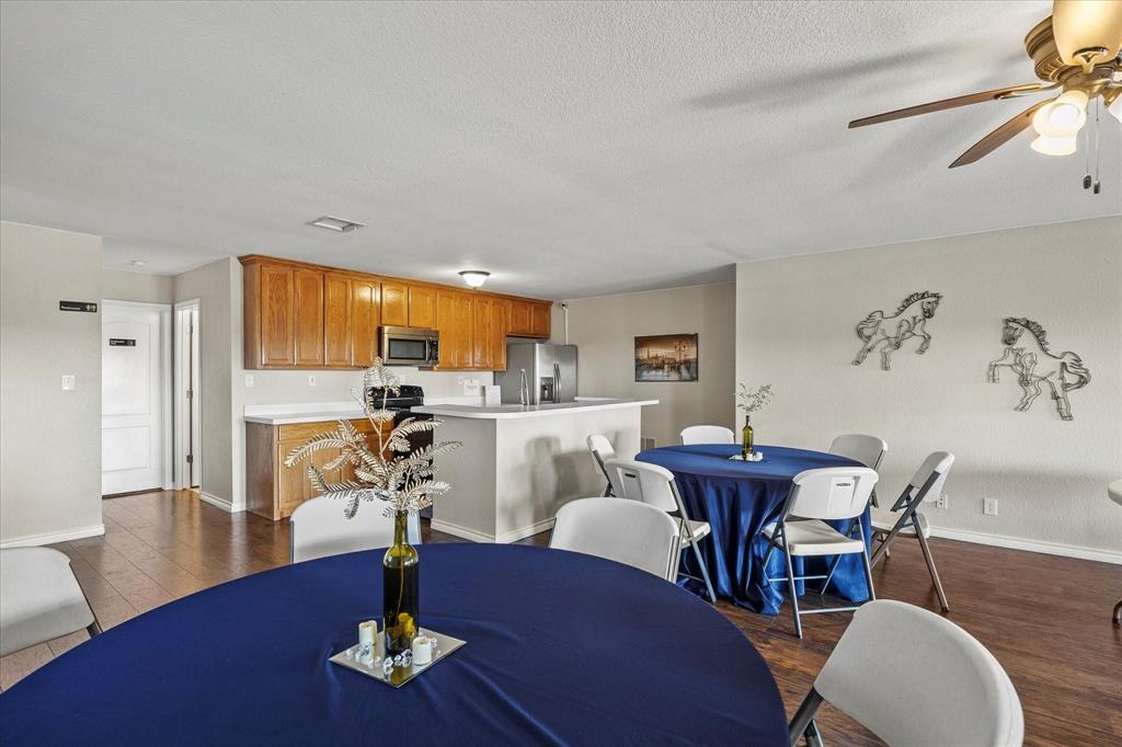 3399 Peterson Road South Iowa Park, TX 76367 - Photo 12 of 40 a living room with furniture a dining table and a window