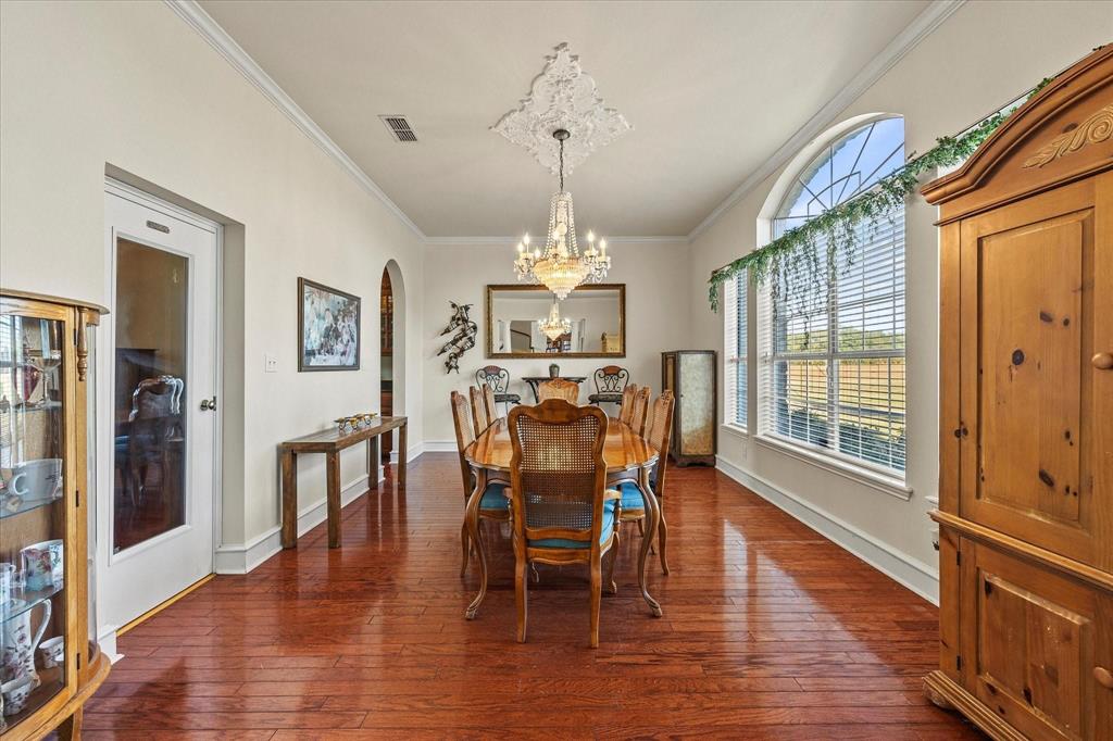 3399 Peterson Road South Iowa Park, TX 76367 - Photo 29 of 40 a view of a dining room with furniture window and wooden floor