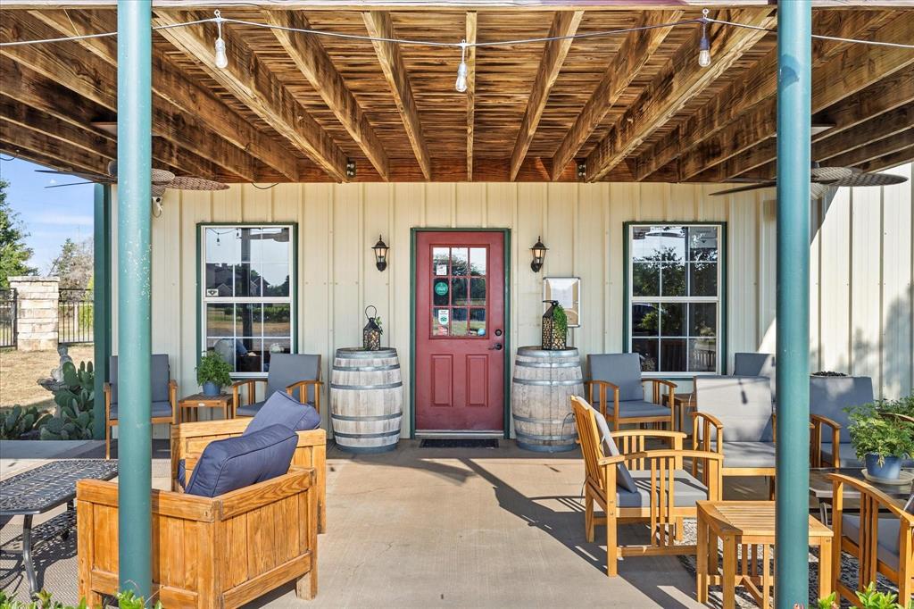 3399 Peterson Road South Iowa Park, TX 76367 - Photo 7 of 40 a building outdoor space with patio furniture and potted plants