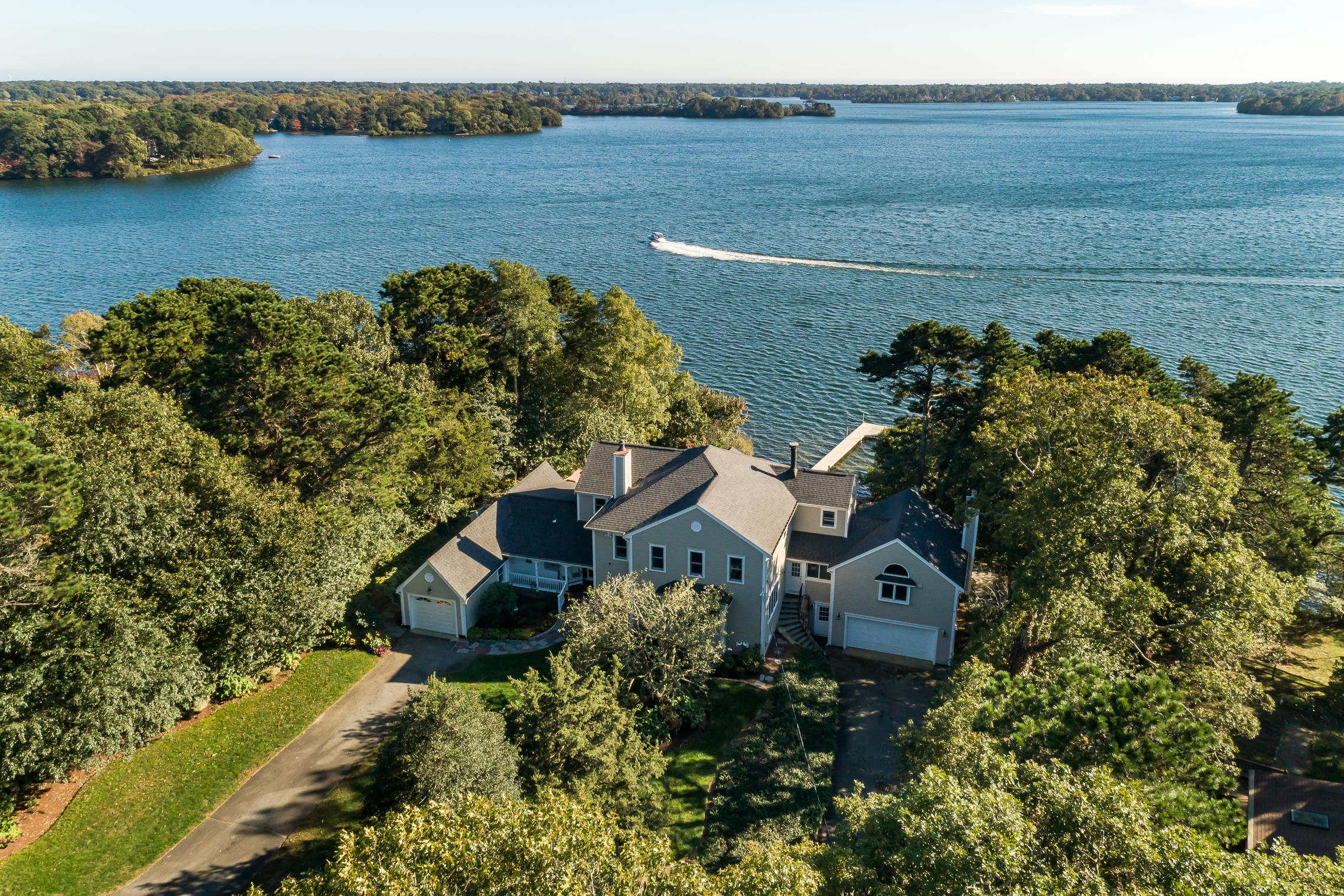 56 Lakeview Drive Centerville, MA 02632 - Photo 1 of 30 an aerial view of a house with a lake view
