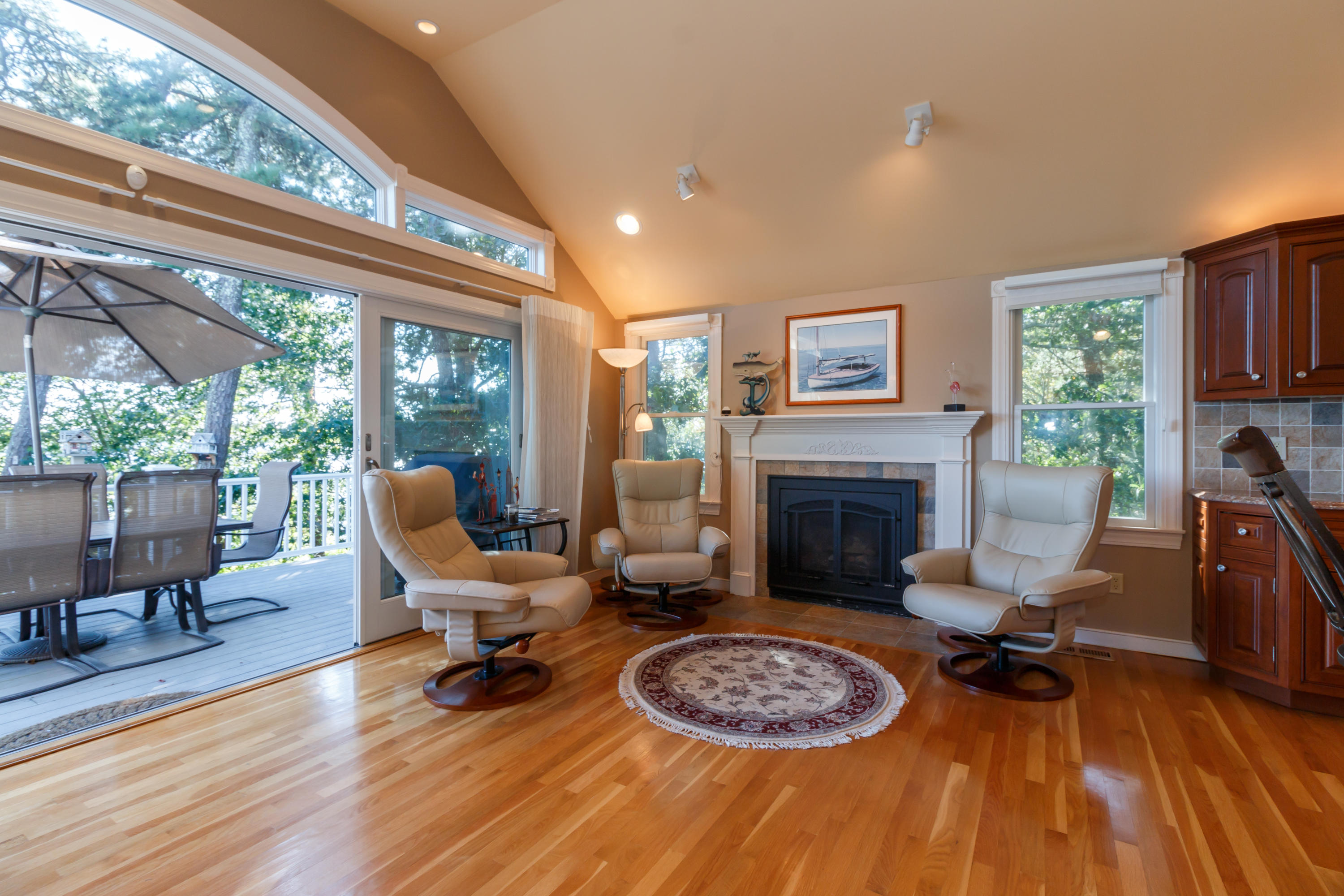 56 Lakeview Drive Centerville, MA 02632 - Photo 17 of 30 a living room with furniture and a fireplace