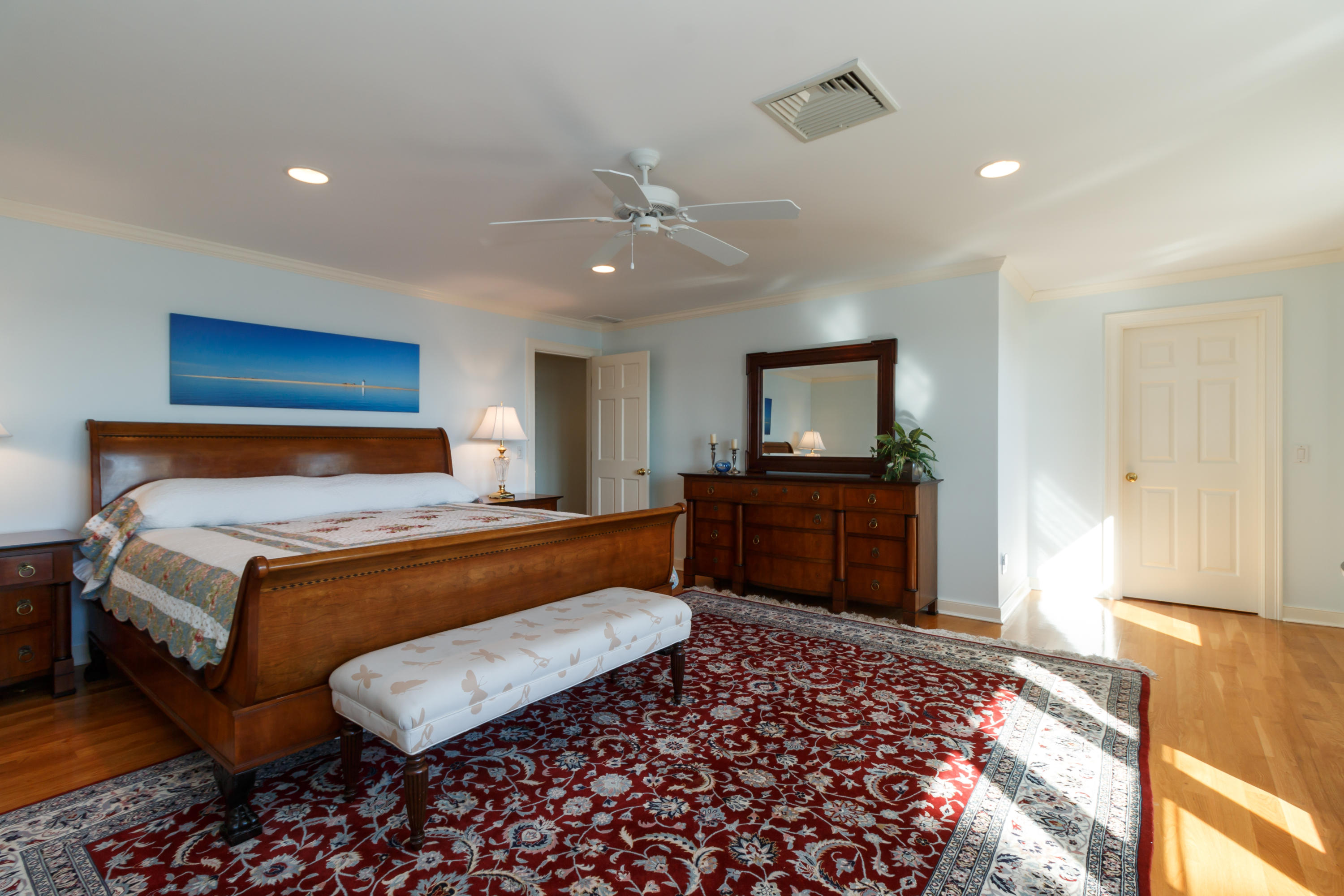 56 Lakeview Drive Centerville, MA 02632 - Photo 18 of 30 a bedroom with a bed and wooden floor