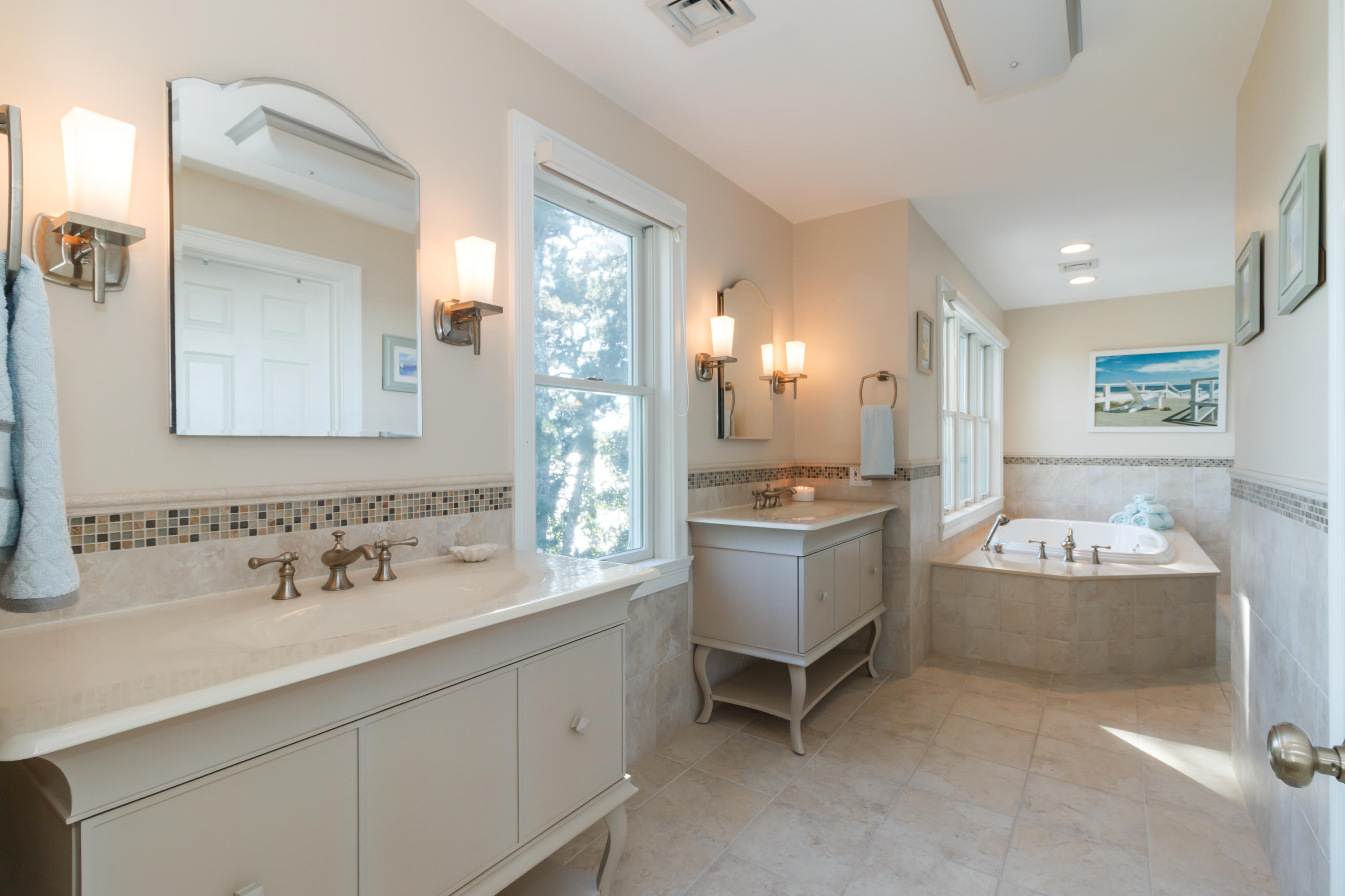 56 Lakeview Drive Centerville, MA 02632 - Photo 20 of 30 a bathroom with a double vanity sink mirror and bathtub