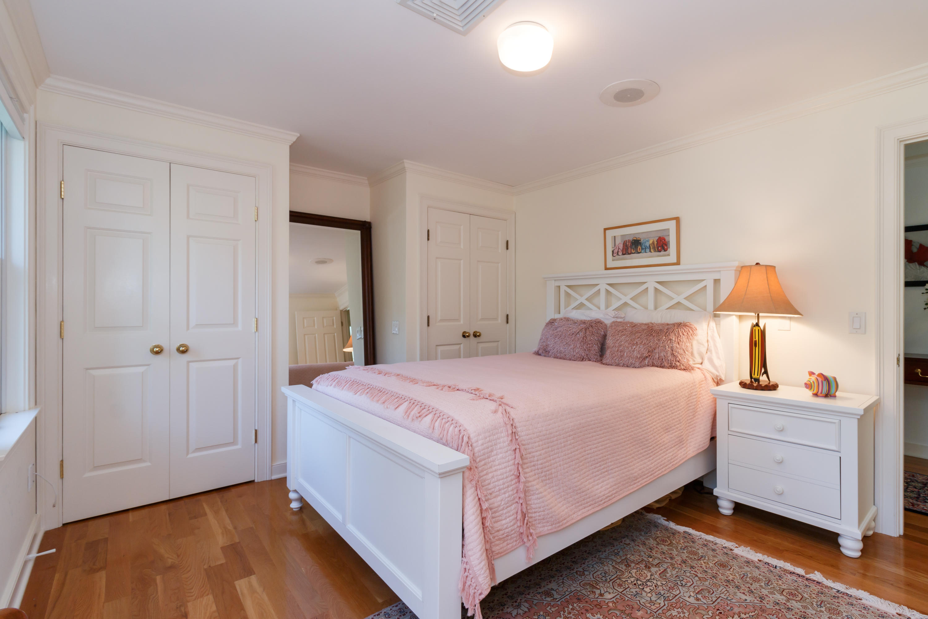 56 Lakeview Drive Centerville, MA 02632 - Photo 21 of 30 a bedroom with a bed and a lamp