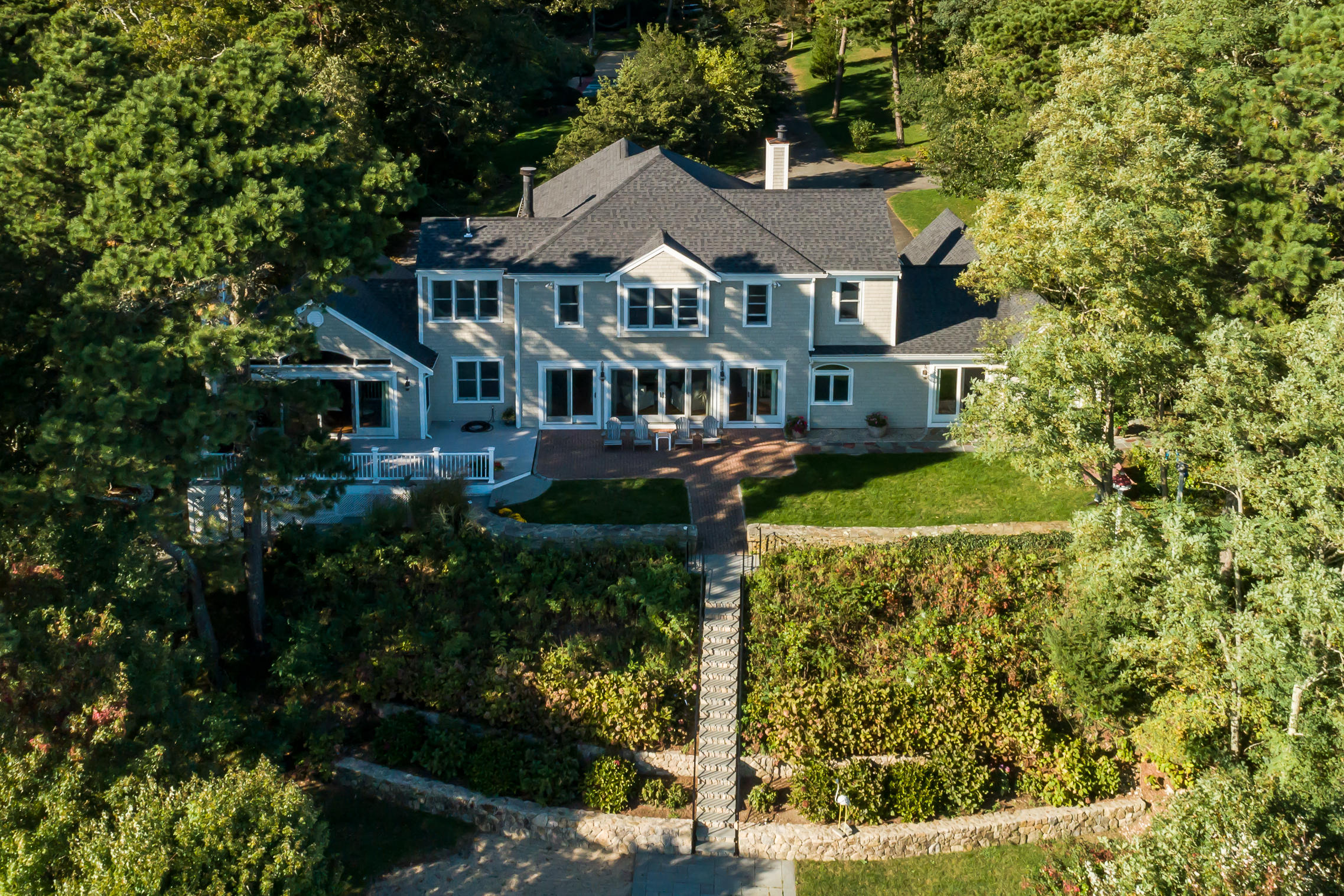 56 Lakeview Drive Centerville, MA 02632 - Photo 3 of 30 a aerial view of a house with a yard and potted plants