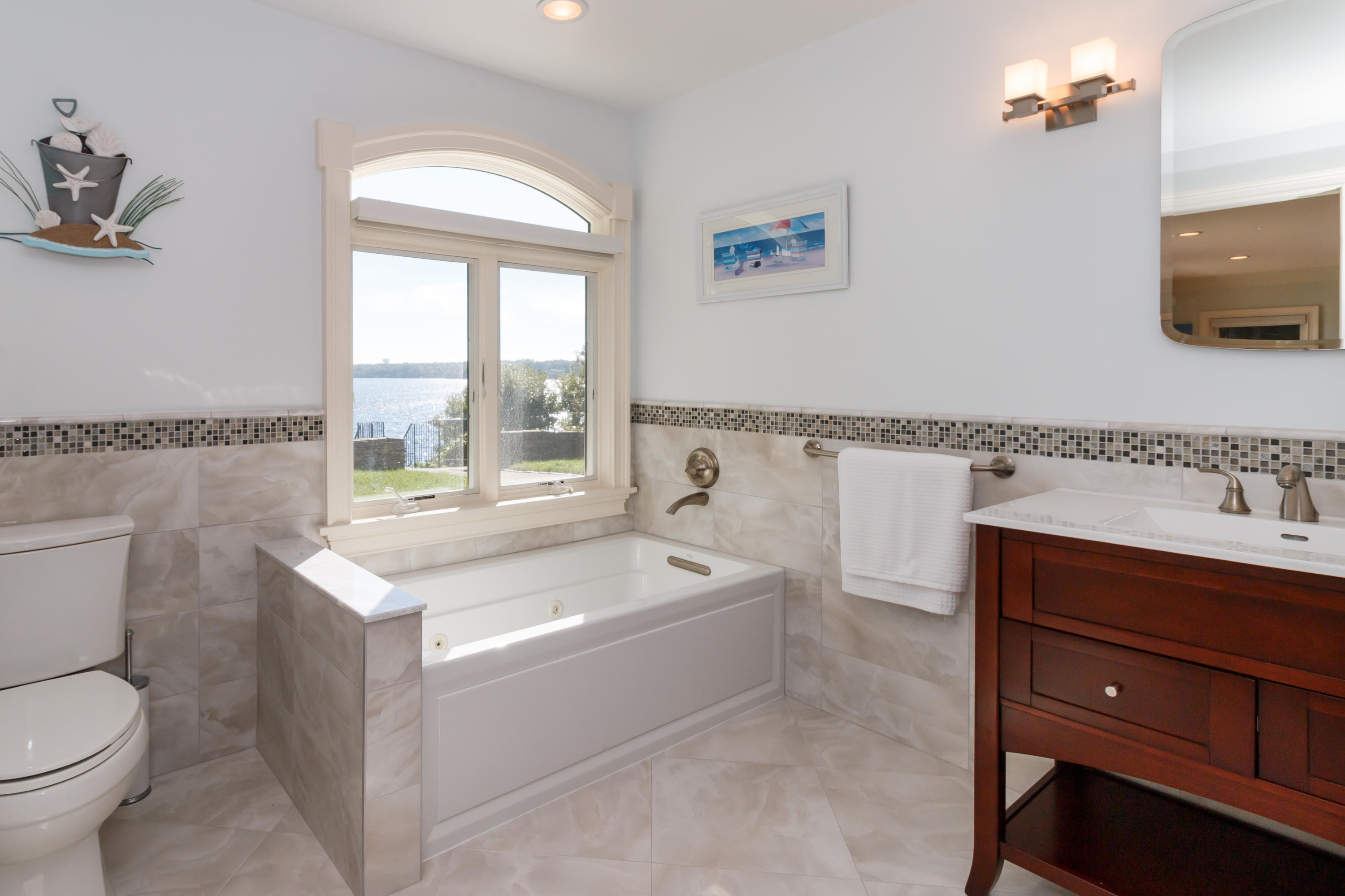 56 Lakeview Drive Centerville, MA 02632 - Photo 9 of 30 a spacious bathroom with a bathtub sink and toilet