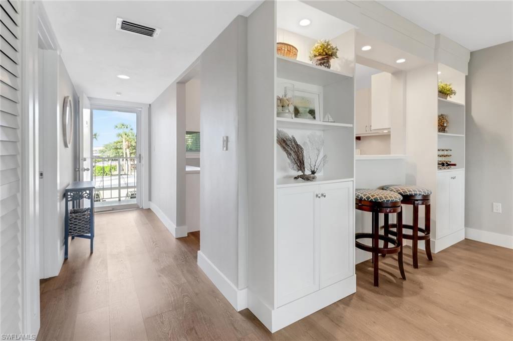 309 Goodlette-Frank Road, Unit A305 Naples, FL 34102 - Photo 1 of 10 Corridor with visible vents, recessed lighting, light wood-type flooring, and baseboards