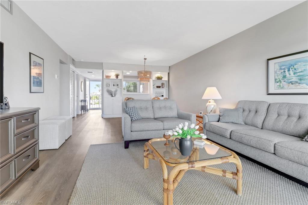 309 Goodlette-Frank Road, Unit A305 Naples, FL 34102 - Photo 2 of 10 Living area with visible vents and wood finished floors