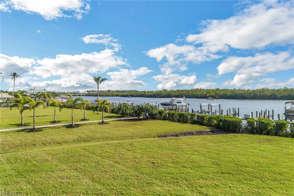 309 Goodlette-Frank Road, Unit A305 Naples, FL 34102 - Photo 9 of 10 View of yard with a boat dock and a water view