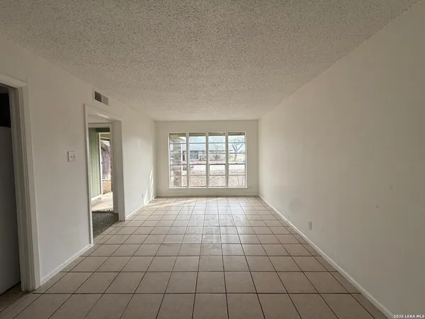 a view of an empty room and window