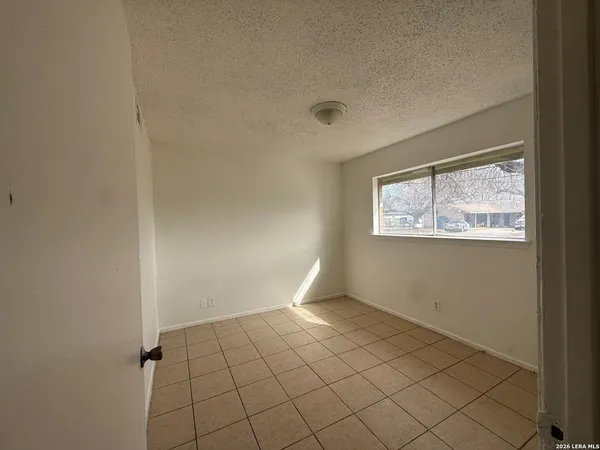 a view of an empty room and window