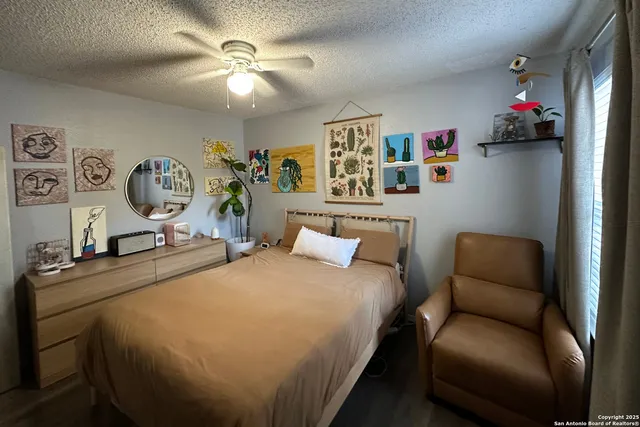 a bedroom with a bed and window