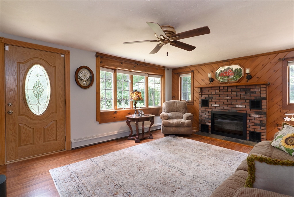 42 Oxbow Road Charlton, MA 01507 - Photo 17 of 42 a living room with furniture a window and a fireplace