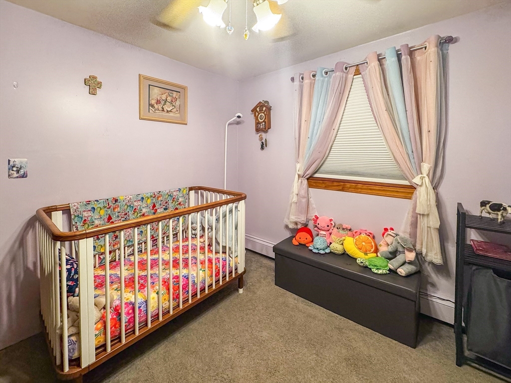 42 Oxbow Road Charlton, MA 01507 - Photo 21 of 42 a bedroom with baby bed toys and a window