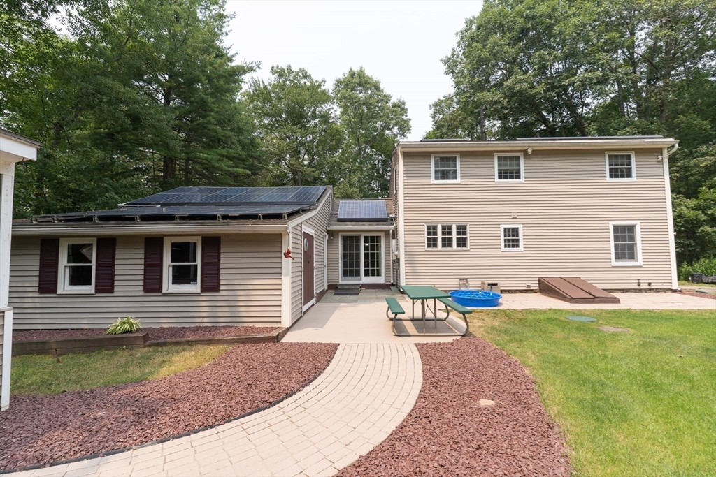 42 Oxbow Road Charlton, MA 01507 - Photo 31 of 42 a front view of a house with a yard chairs and table