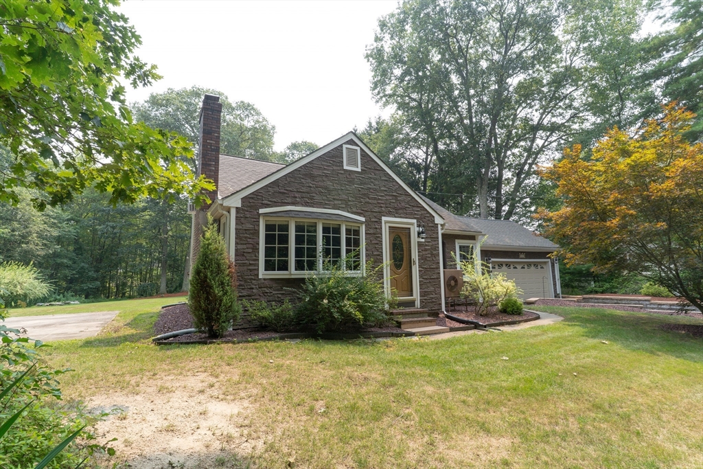42 Oxbow Road Charlton, MA 01507 - Photo 4 of 42 a front view of house with yard and trees around