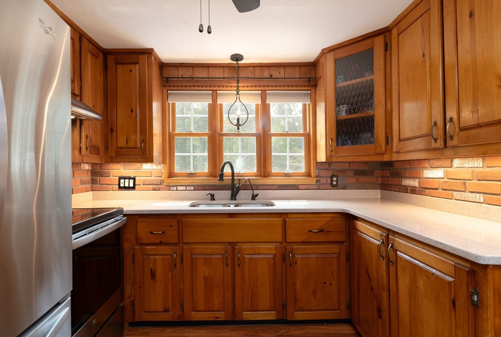 42 Oxbow Road Charlton, MA 01507 - Photo 10 of 42 a kitchen with stainless steel appliances granite countertop a sink stove and cabinets