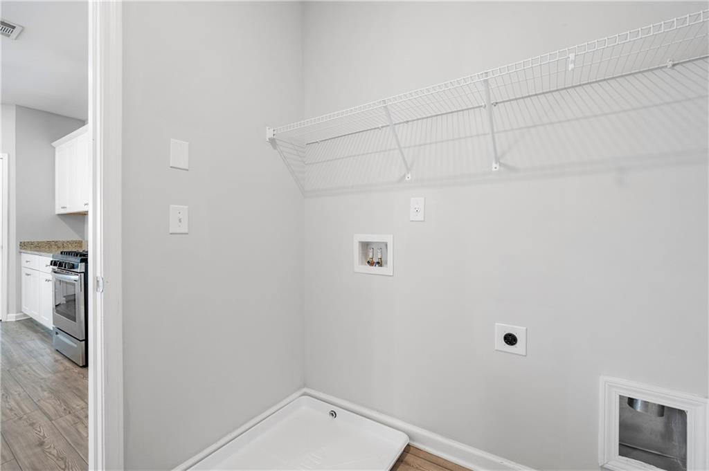 4646 Waxwing Street Hoschton, GA 30548 - Photo 14 of 36 a view of utility room