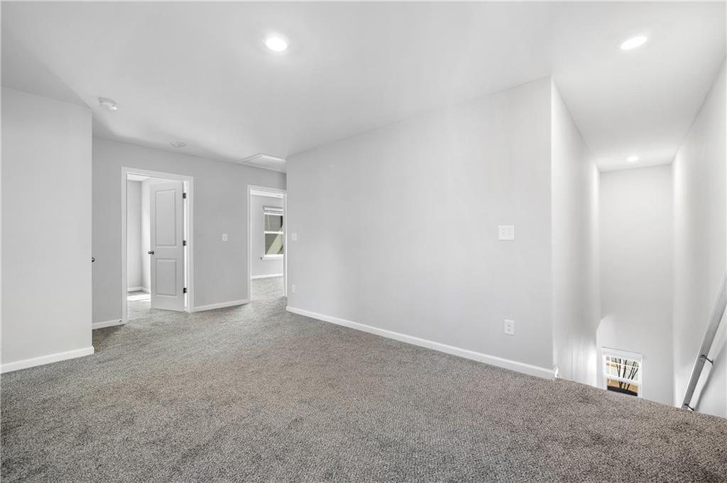 4646 Waxwing Street Hoschton, GA 30548 - Photo 15 of 36 a view of an empty room