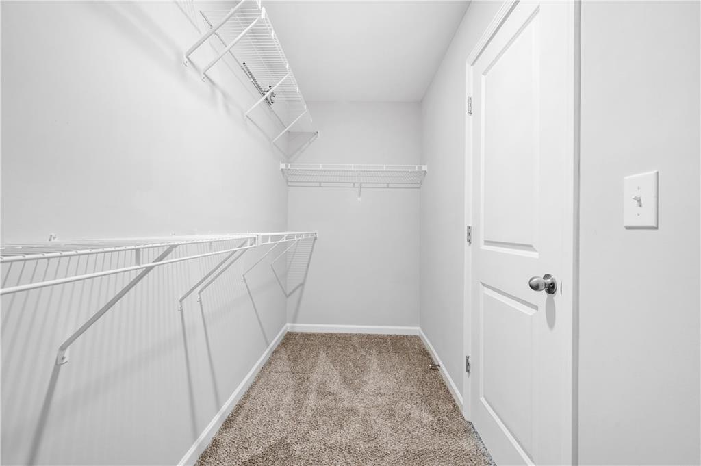 4646 Waxwing Street Hoschton, GA 30548 - Photo 22 of 36 a view of a hallway with stairs