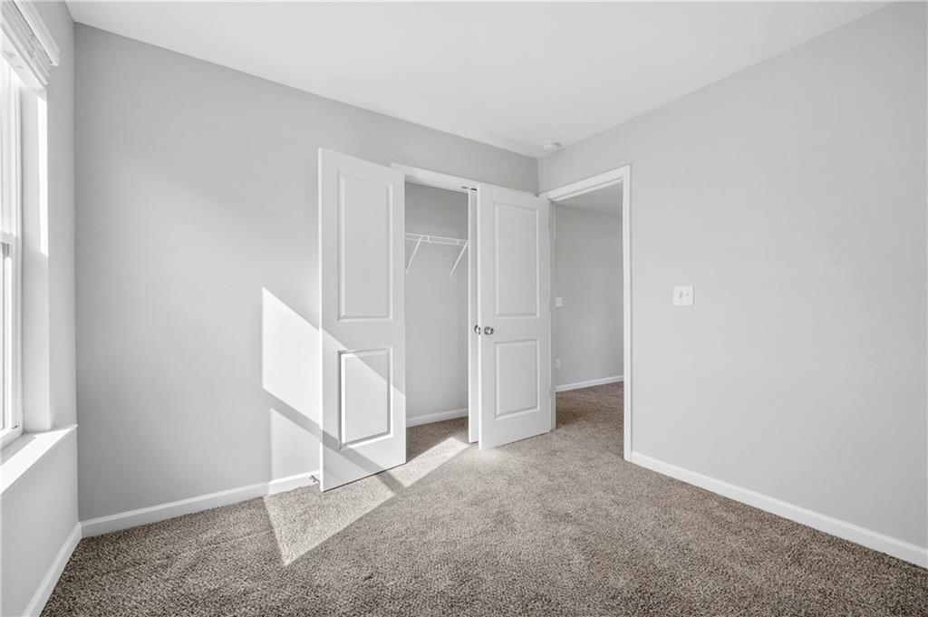 4646 Waxwing Street Hoschton, GA 30548 - Photo 24 of 36 a view of an empty room