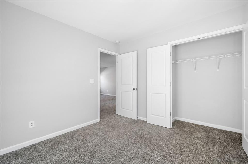 4646 Waxwing Street Hoschton, GA 30548 - Photo 26 of 36 a view of an empty room