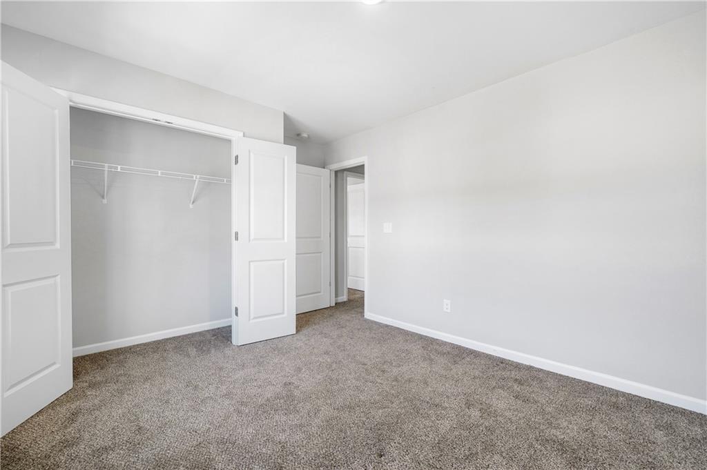4646 Waxwing Street Hoschton, GA 30548 - Photo 30 of 36 a view of an empty room