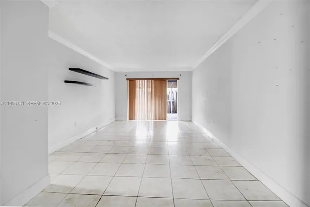 a view of an empty room and window