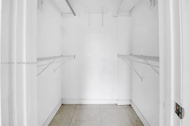 a view of an empty walk in closet