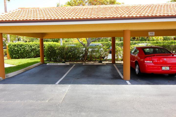 157 Yacht Club Way, Unit 201 CORNER Hypoluxo, FL 33462 - Photo 15 of 24 a view of a swimming pool with an outdoor space and seating area