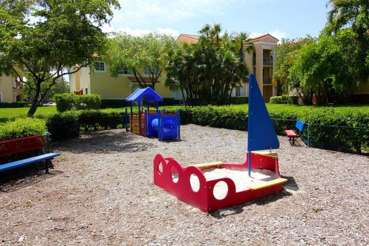 157 Yacht Club Way, Unit 201 CORNER Hypoluxo, FL 33462 - Photo 19 of 24 a view of outdoor space yard and patio